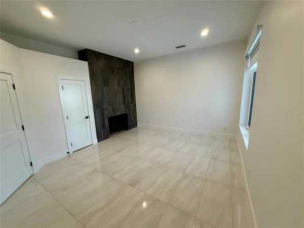 a front view of a house with yard and green space