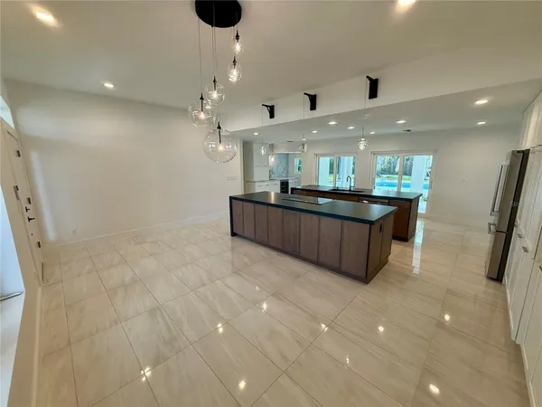 a large bathroom with a large tub and sink