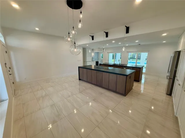 a large bathroom with a large tub and sink