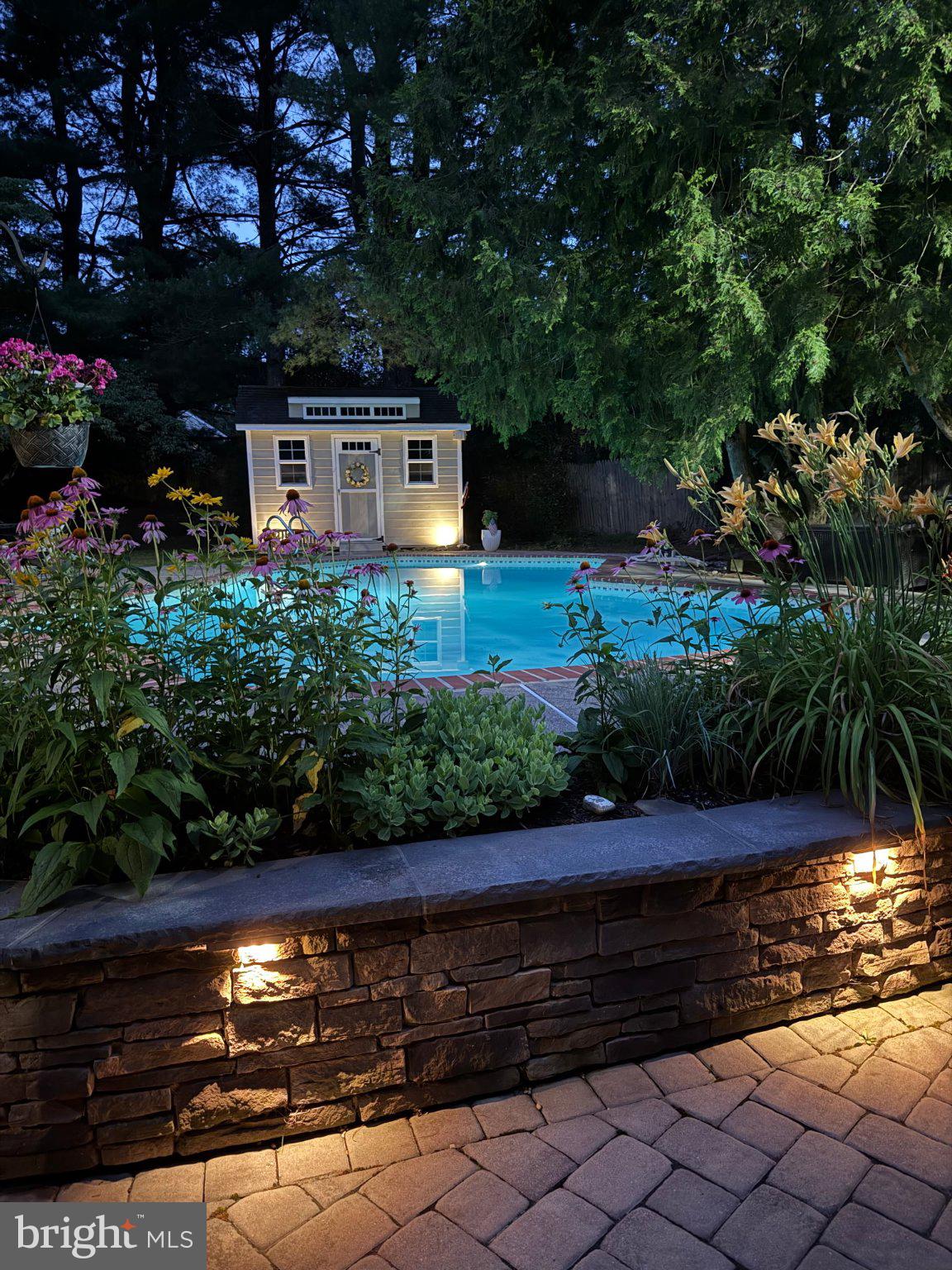 17 Stringer Drive Doylestown, PA 18901 - Photo 69 of 80 Serene evening by the illuminated pool.