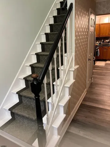 a bedroom with a bed window and couch