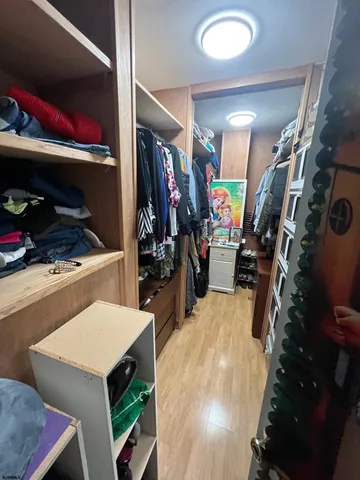 a bathroom with a double vanity sink mirror and toilet
