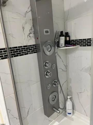 a bathroom with a sink and a shower