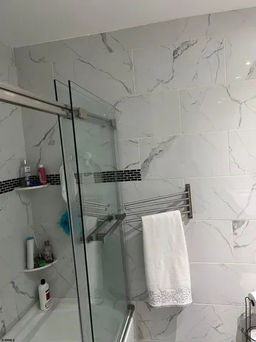 a bathroom with a double vanity sink toilet and mirror
