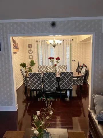 a living room with furniture and a mirror