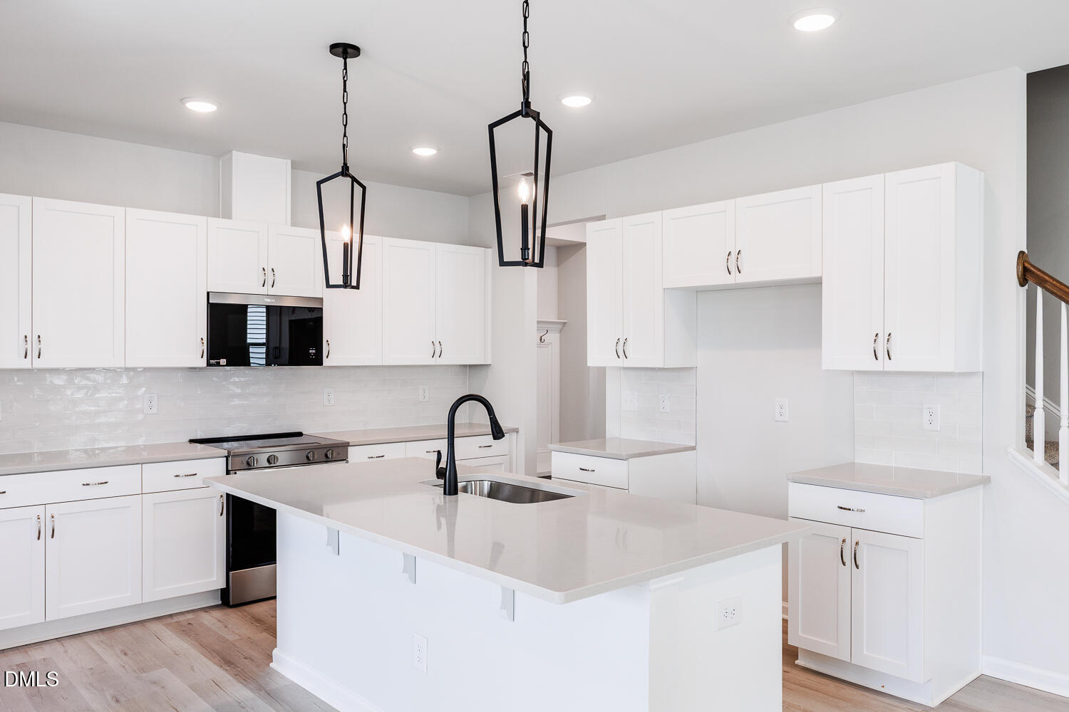 144 Siebold Street Garner, NC 27529 - Photo 12 of 40 a kitchen with appliances a sink and cabinets