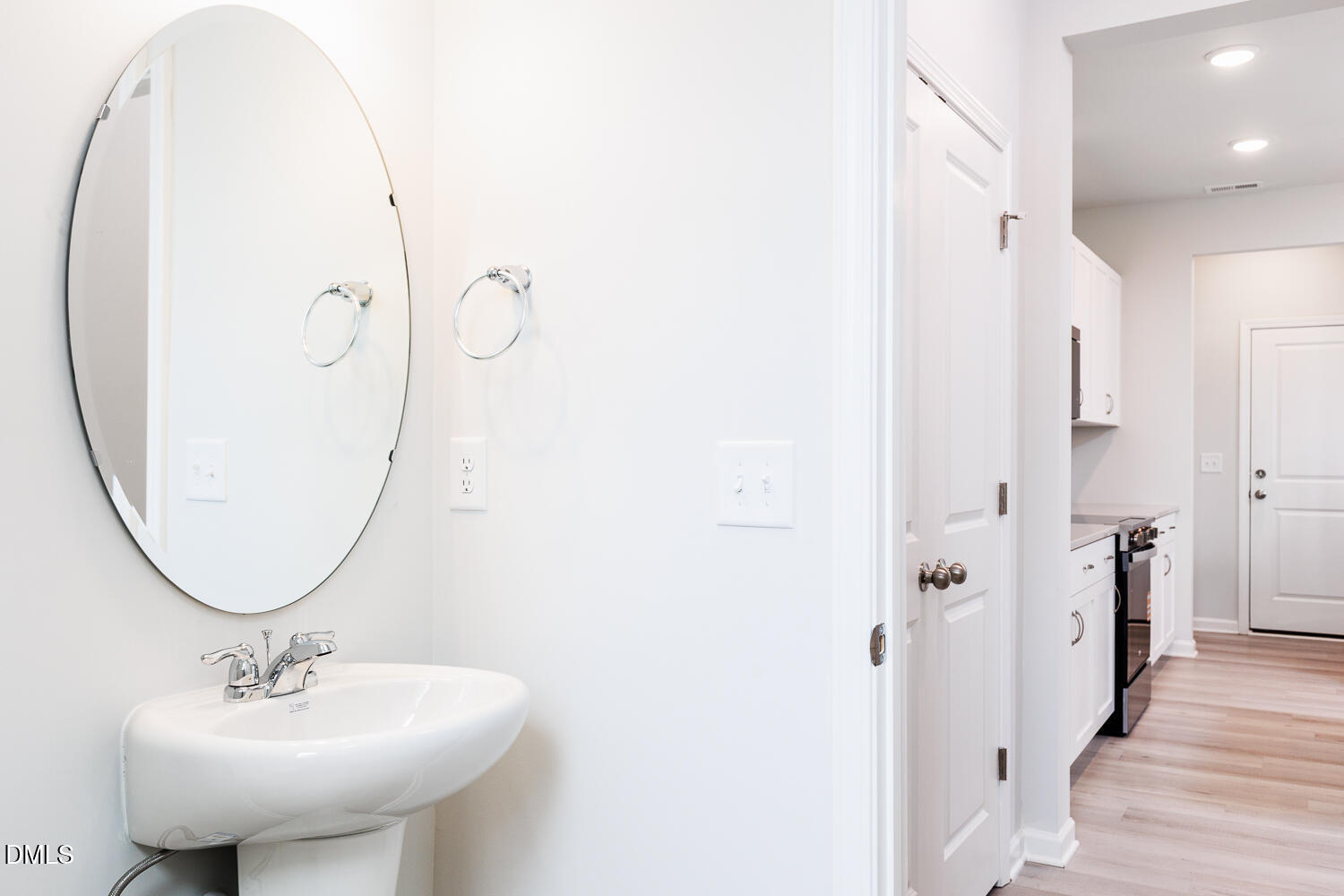 144 Siebold Street Garner, NC 27529 - Photo 17 of 40 a bathroom with a sink a mirror a vanity and a shower