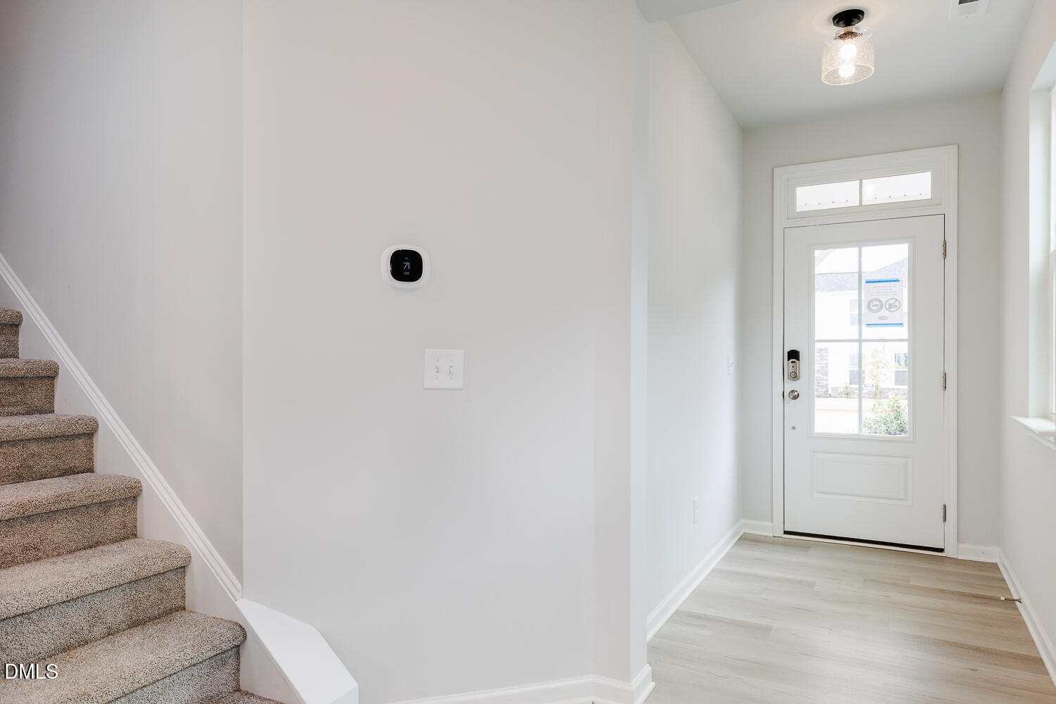 144 Siebold Street Garner, NC 27529 - Photo 22 of 40 a view of a hallway with wooden floor and entryway