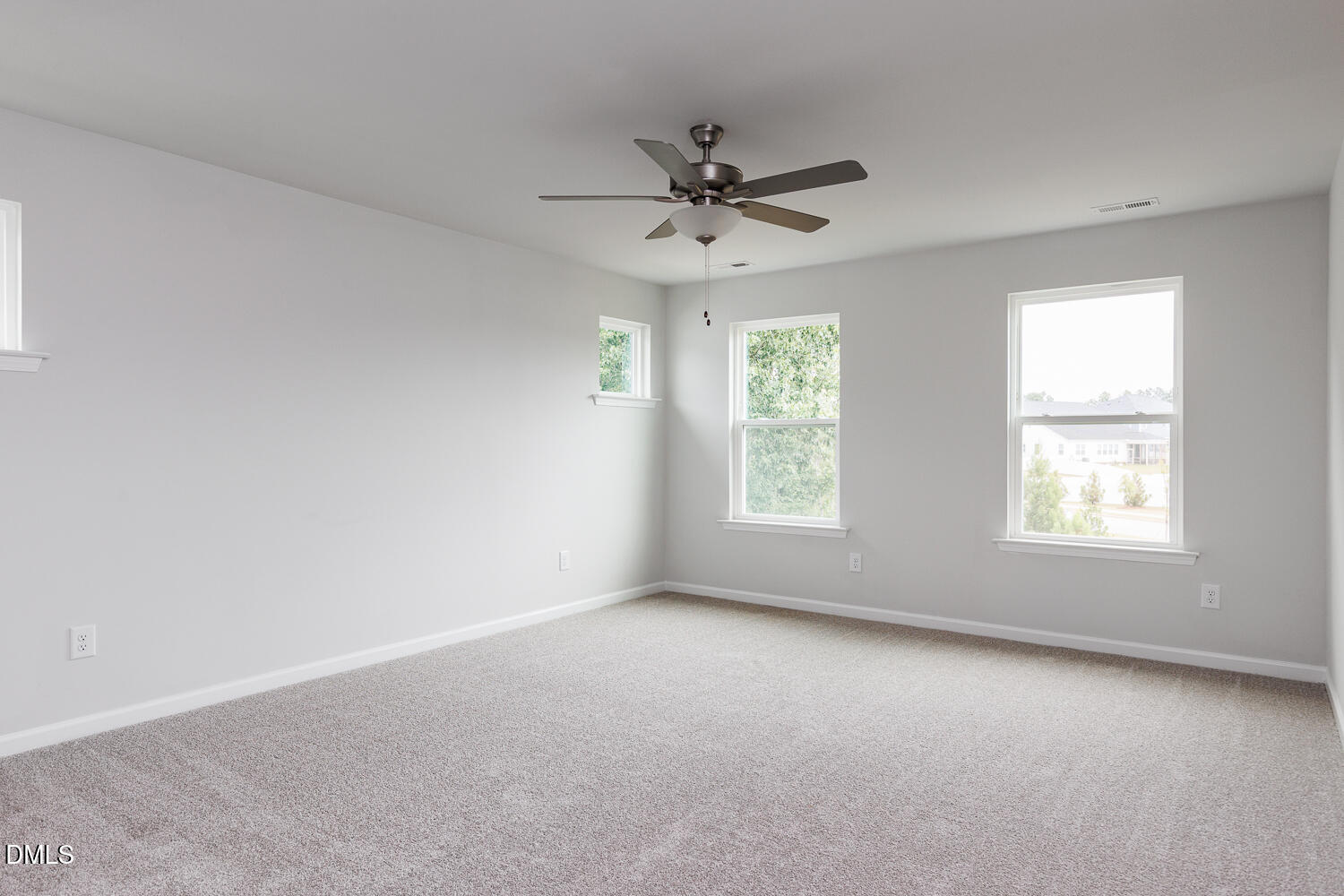 144 Siebold Street Garner, NC 27529 - Photo 26 of 40 an empty room with a window and a fan