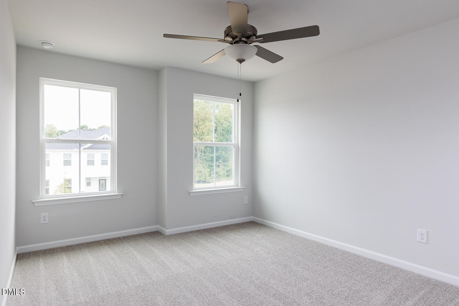 144 Siebold Street Garner, NC 27529 - Photo 32 of 40 an empty room with a window and a fan