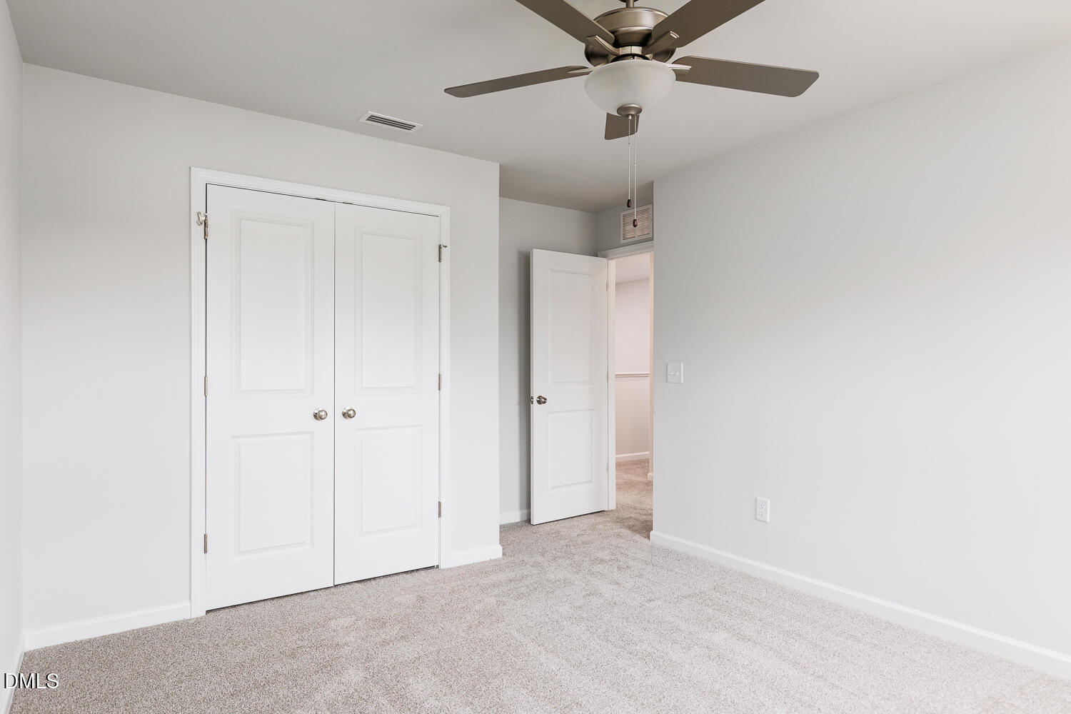 144 Siebold Street Garner, NC 27529 - Photo 33 of 40 an empty room with a ceiling fan and a window