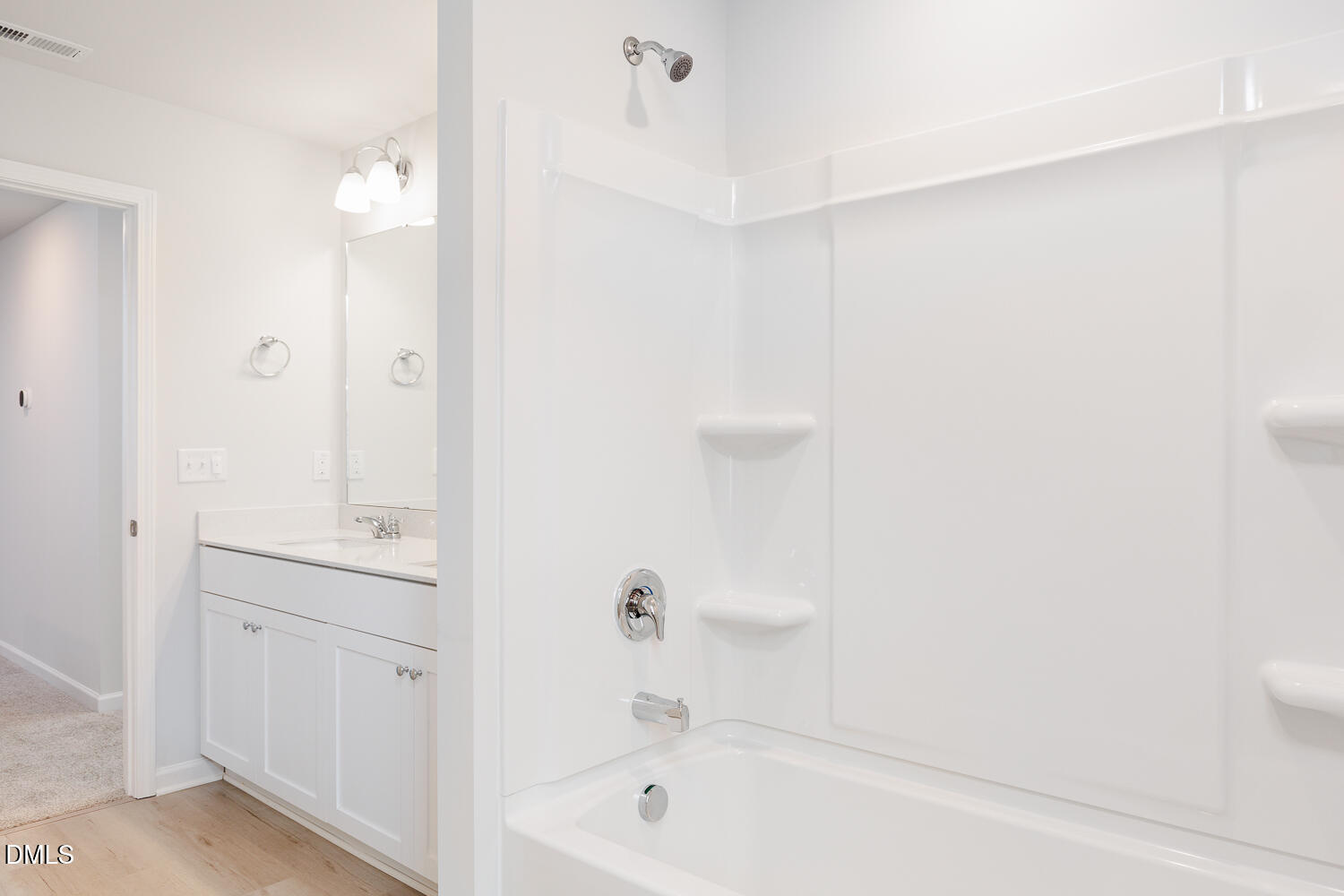 144 Siebold Street Garner, NC 27529 - Photo 35 of 40 a bathroom with a tub shower and sink