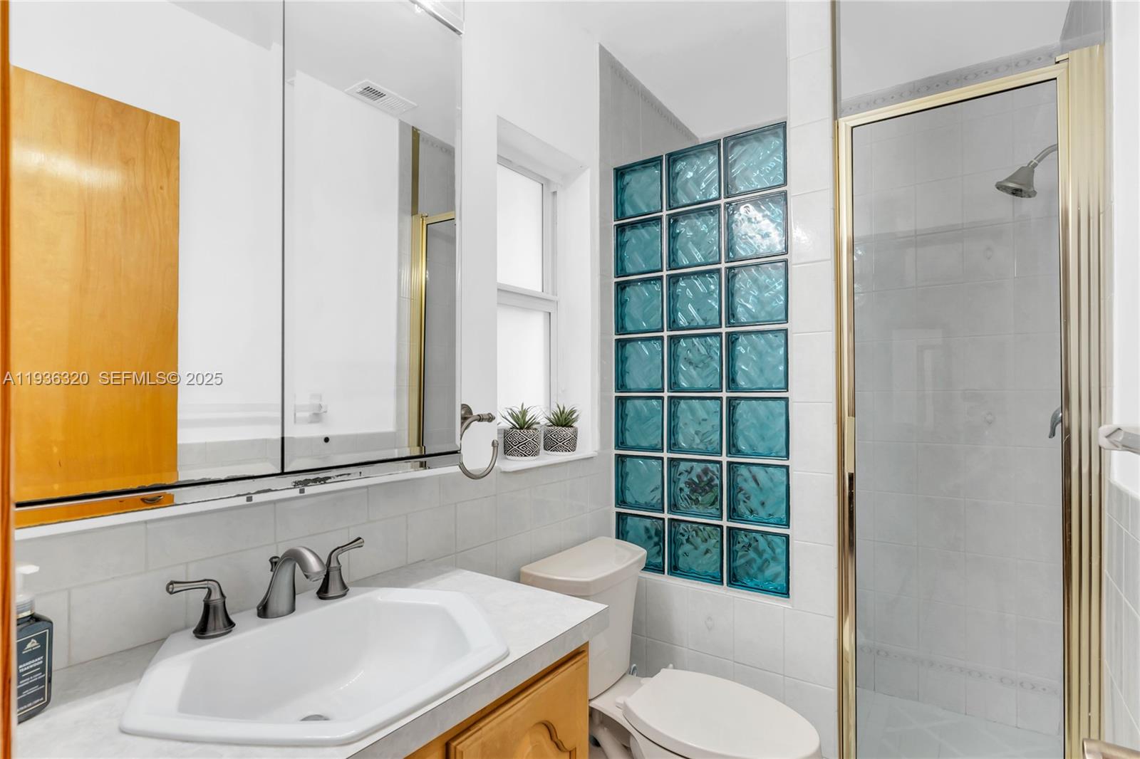 610 Northwest 16th Street Homestead, FL 33030 - Photo 12 of 27 a bathroom with a sink toilet and shower