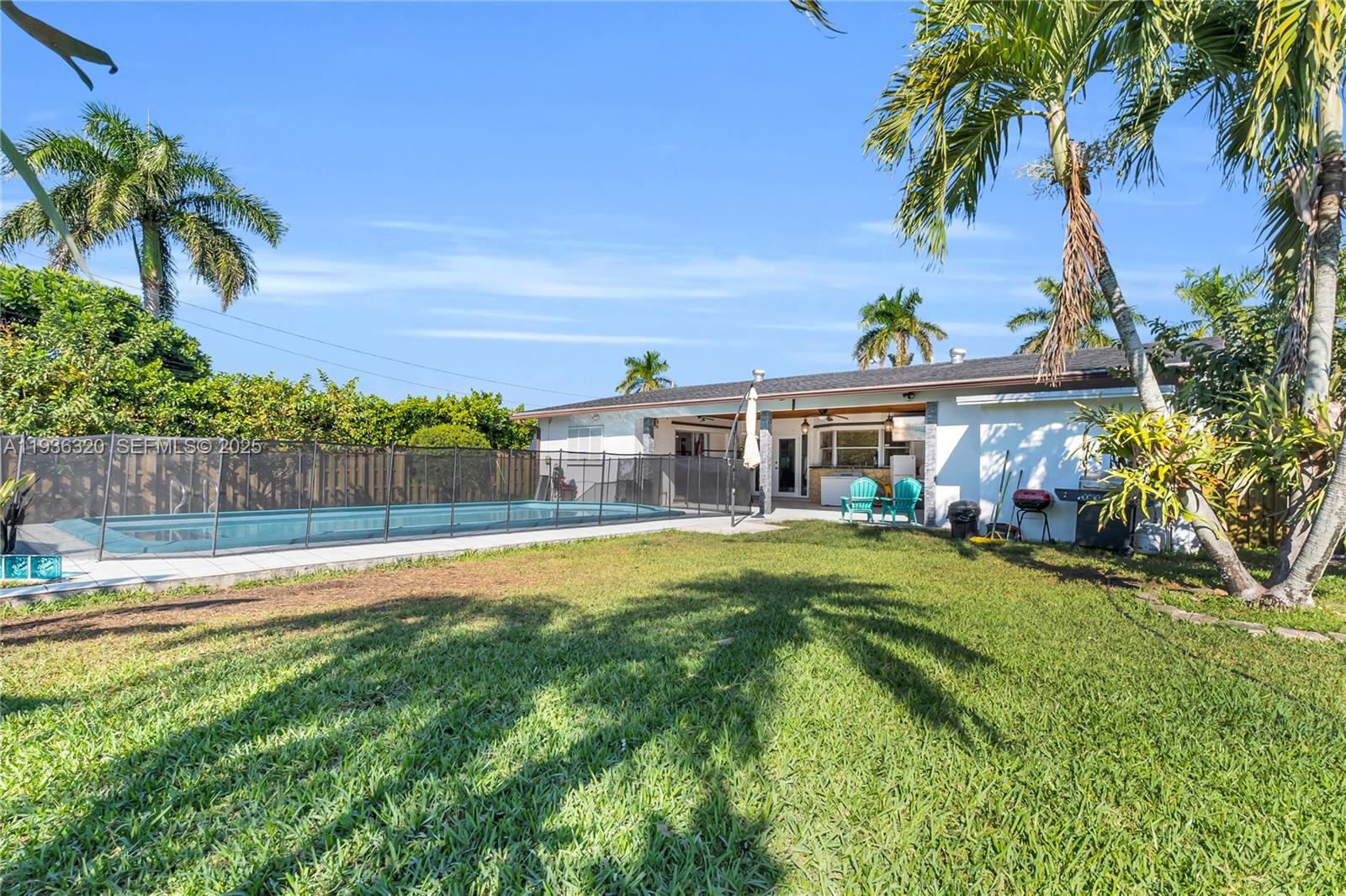 610 Northwest 16th Street Homestead, FL 33030 - Photo 16 of 27 a view of a house with a swimming pool