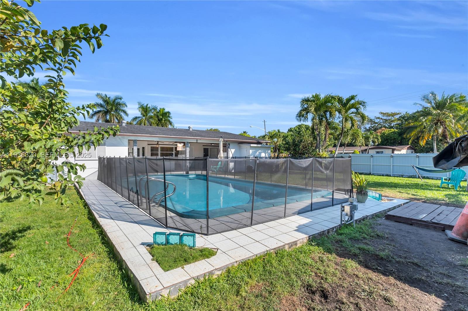 610 Northwest 16th Street Homestead, FL 33030 - Photo 18 of 27 a view of a swimming pool with a patio