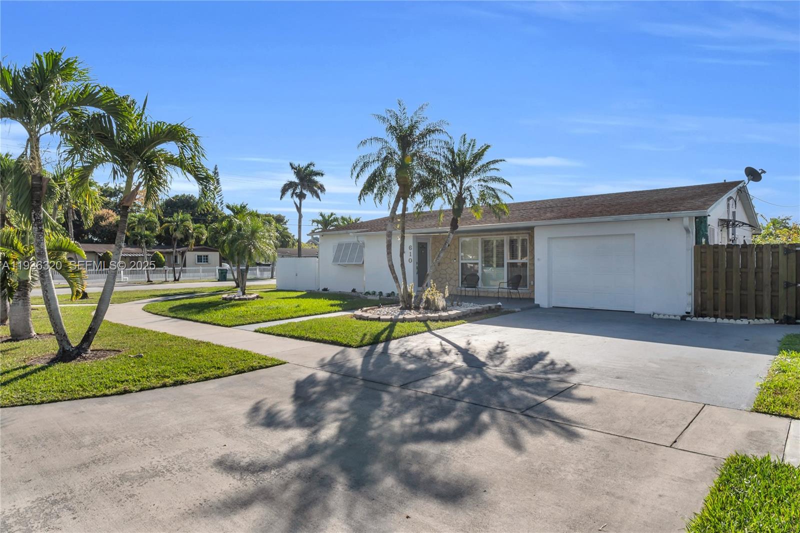 610 Northwest 16th Street Homestead, FL 33030 - Photo 2 of 27 a view of a house with swimming pool and a yard