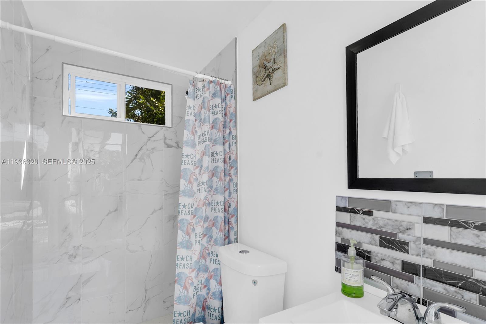 610 Northwest 16th Street Homestead, FL 33030 - Photo 21 of 27 a bathroom with a sink and a mirror