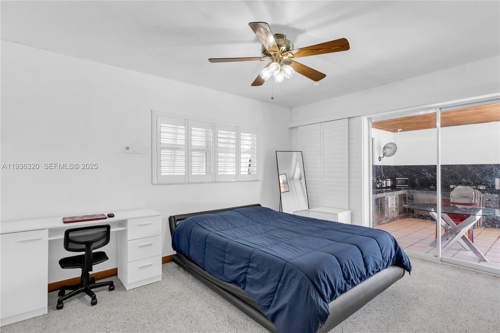 610 Northwest 16th Street Homestead, FL 33030 - Photo 22 of 27 a bedroom with a large bed and a chandelier