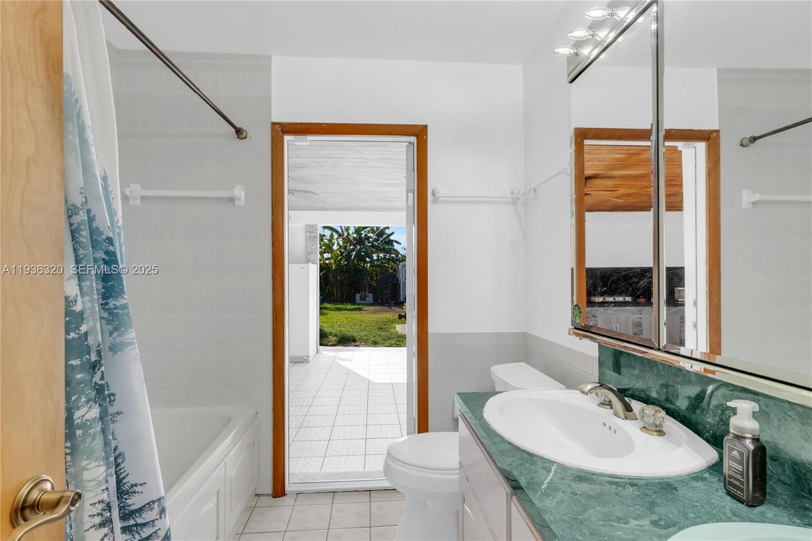 610 Northwest 16th Street Homestead, FL 33030 - Photo 23 of 27 a bathroom with a granite countertop sink and a mirror