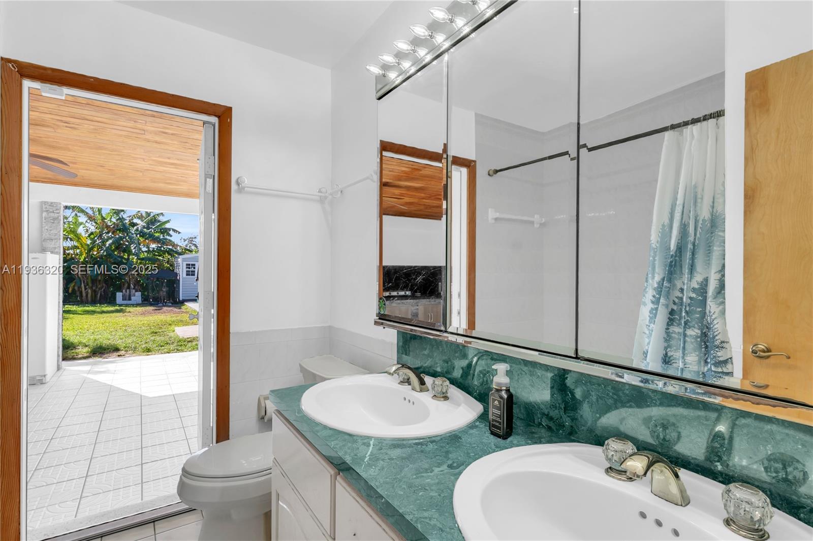 610 Northwest 16th Street Homestead, FL 33030 - Photo 24 of 27 a bathroom with a granite countertop sink mirror and a bathtub