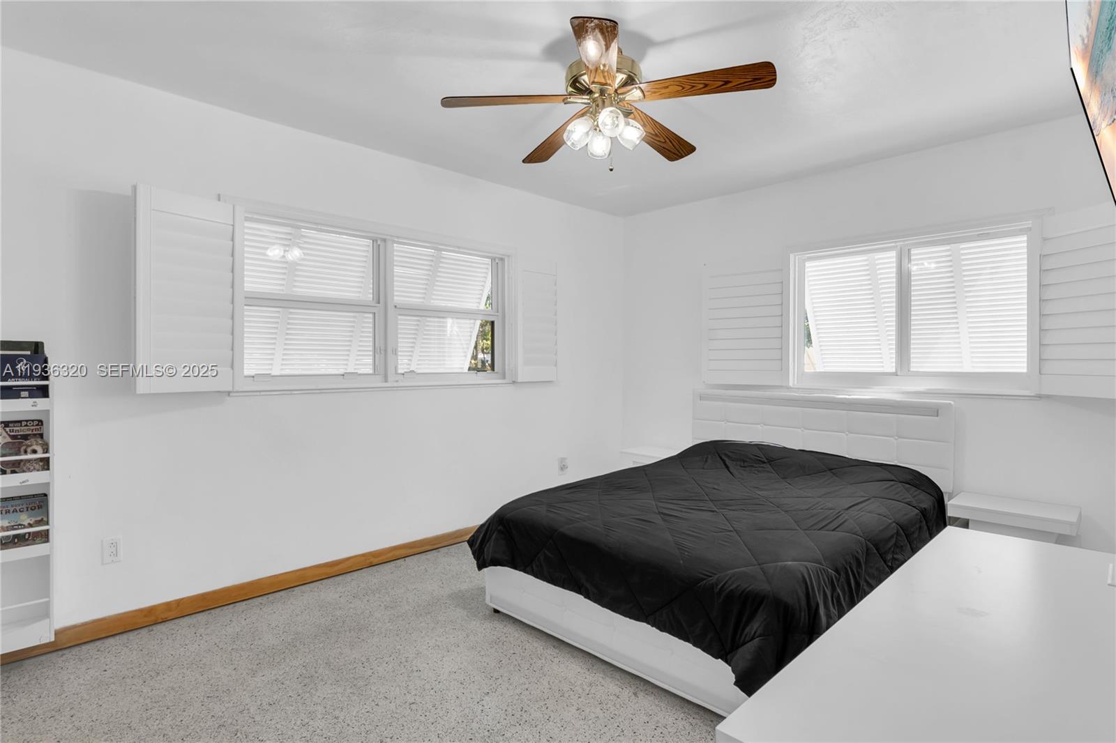 610 Northwest 16th Street Homestead, FL 33030 - Photo 26 of 27 a bedroom with a bed and window