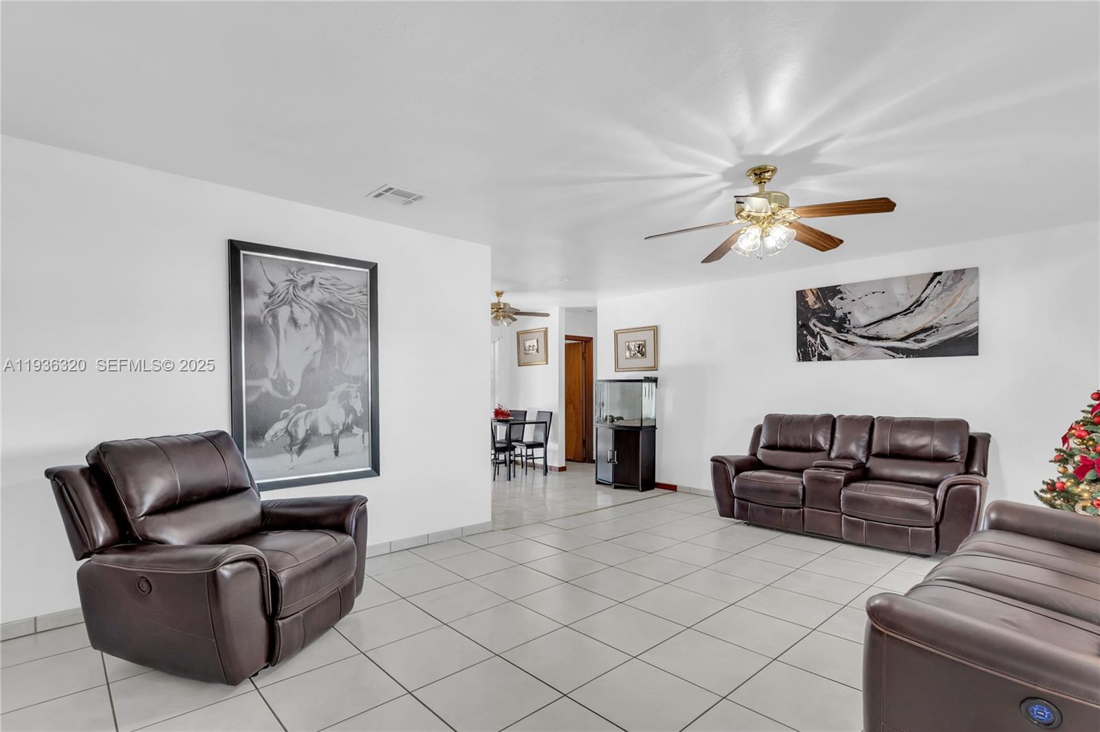 610 Northwest 16th Street Homestead, FL 33030 - Photo 3 of 27 a living room with furniture and a ceiling fan