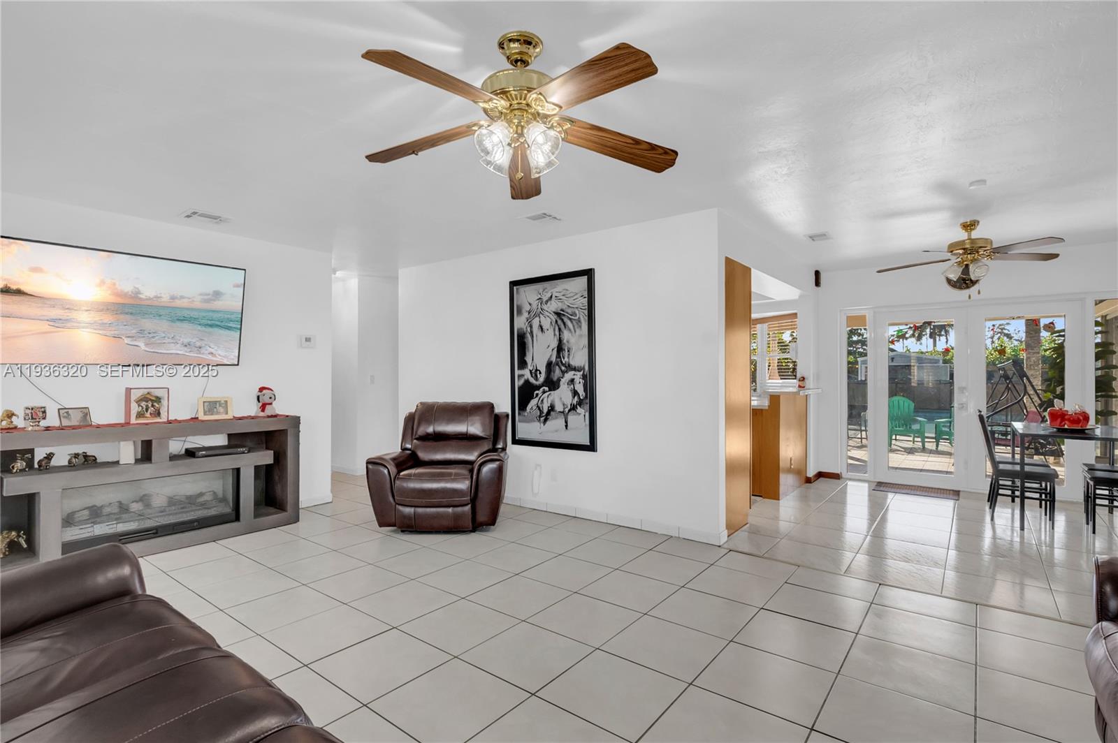 610 Northwest 16th Street Homestead, FL 33030 - Photo 5 of 27 a living room with furniture and a flat screen tv