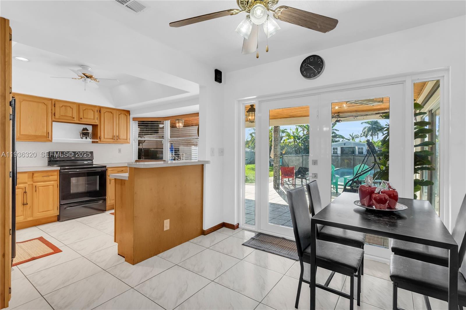 610 Northwest 16th Street Homestead, FL 33030 - Photo 6 of 27 a kitchen with stainless steel appliances granite countertop a stove and a refrigerator