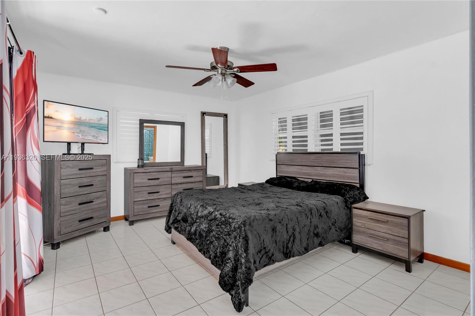 610 Northwest 16th Street Homestead, FL 33030 - Photo 10 of 27 a bedroom with a bed and dresser