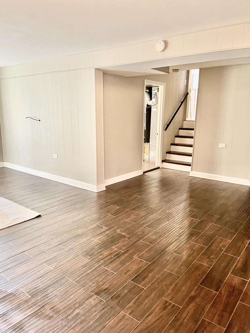 200 77th Street Burr Ridge, IL 60527 - Photo 16 of 33 an empty room with wooden floor and windows