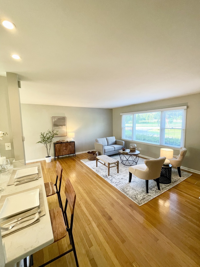 200 77th Street Burr Ridge, IL 60527 - Photo 5 of 33 a living room with fireplace furniture and a table