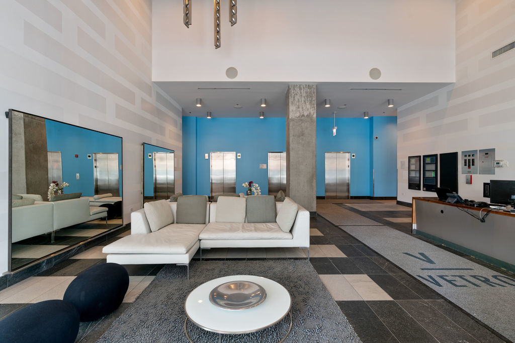 611 South Wells Street, Unit 2705 Chicago, IL 60607 - Photo 19 of 23 a living room with furniture and a flat screen tv