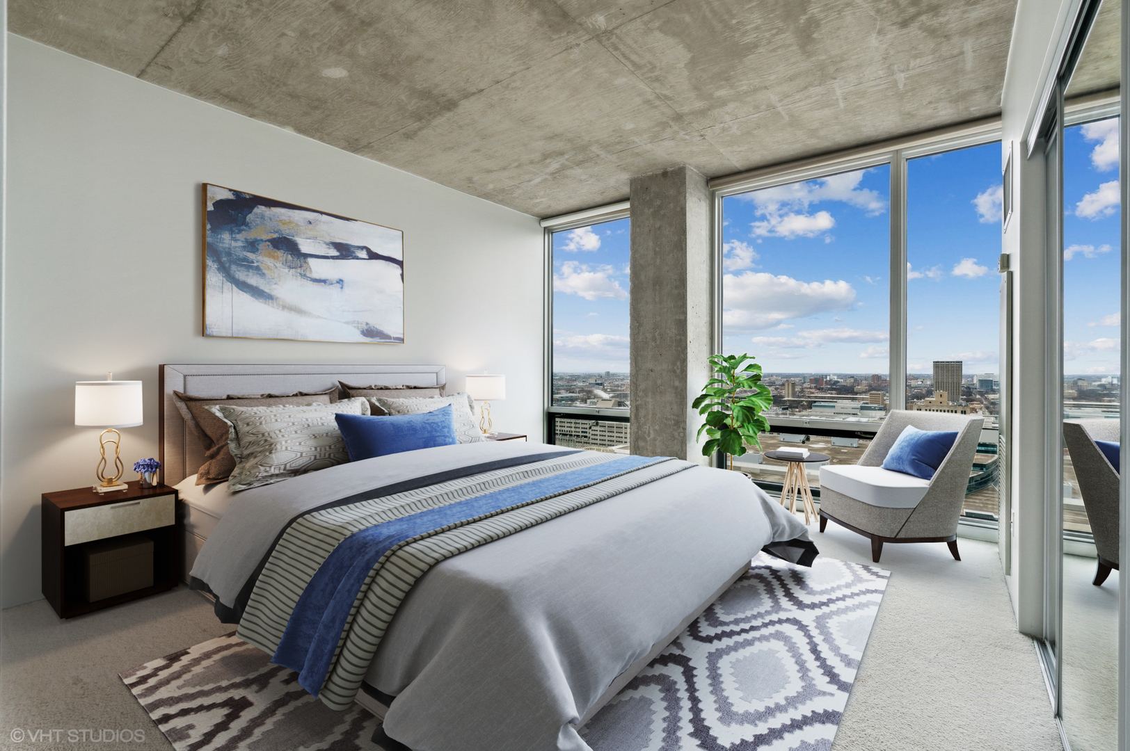 611 South Wells Street, Unit 2705 Chicago, IL 60607 - Photo 10 of 23 a bedroom with a bed a large window with table and chairs