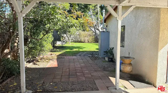 a view of a pathway with a yard