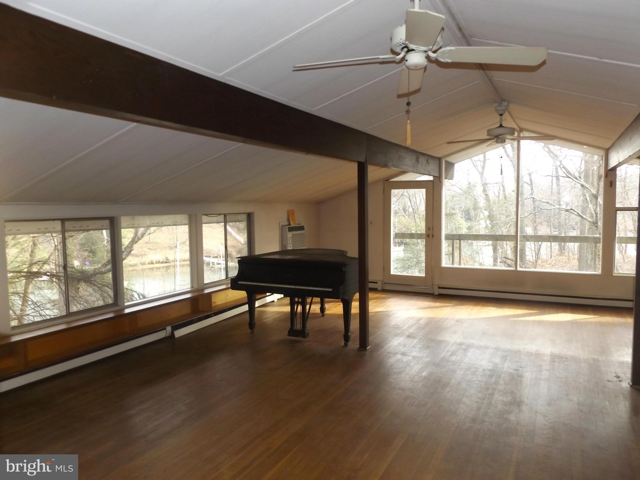 857 Childs Point Road Annapolis, MD 21401 - Photo 16 of 29 lots of windows in the great room