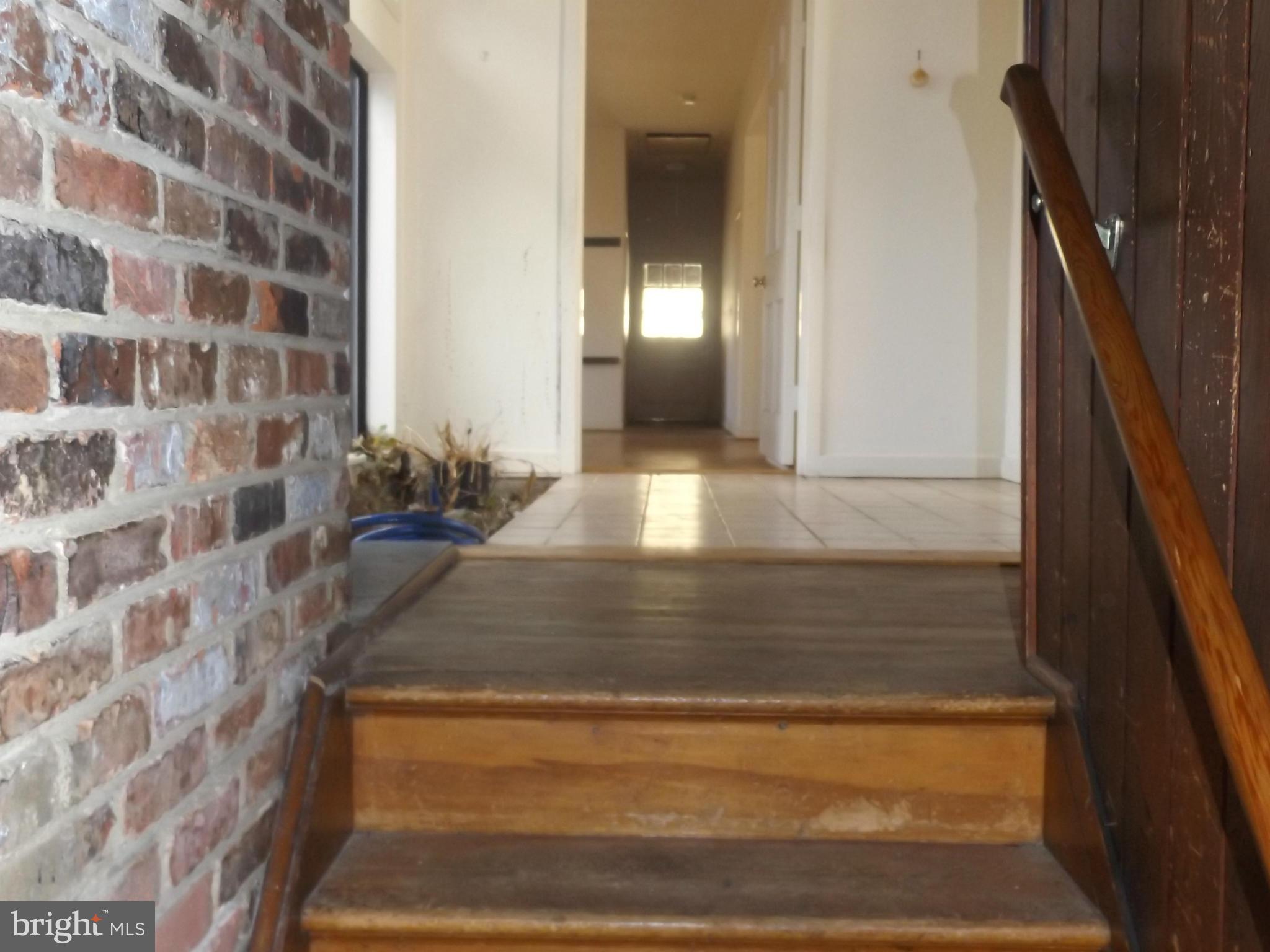 857 Childs Point Road Annapolis, MD 21401 - Photo 28 of 29 wooden stairs view from lower to main level