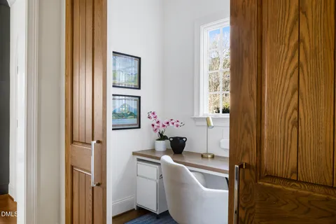 a bathroom with a double vanity sink mirror and toilet