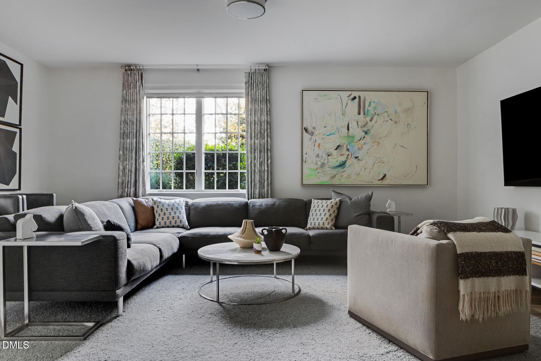 3100 Georgian Terrace Raleigh, NC 27607 - Photo 36 of 74 a living room with furniture and a flat screen tv