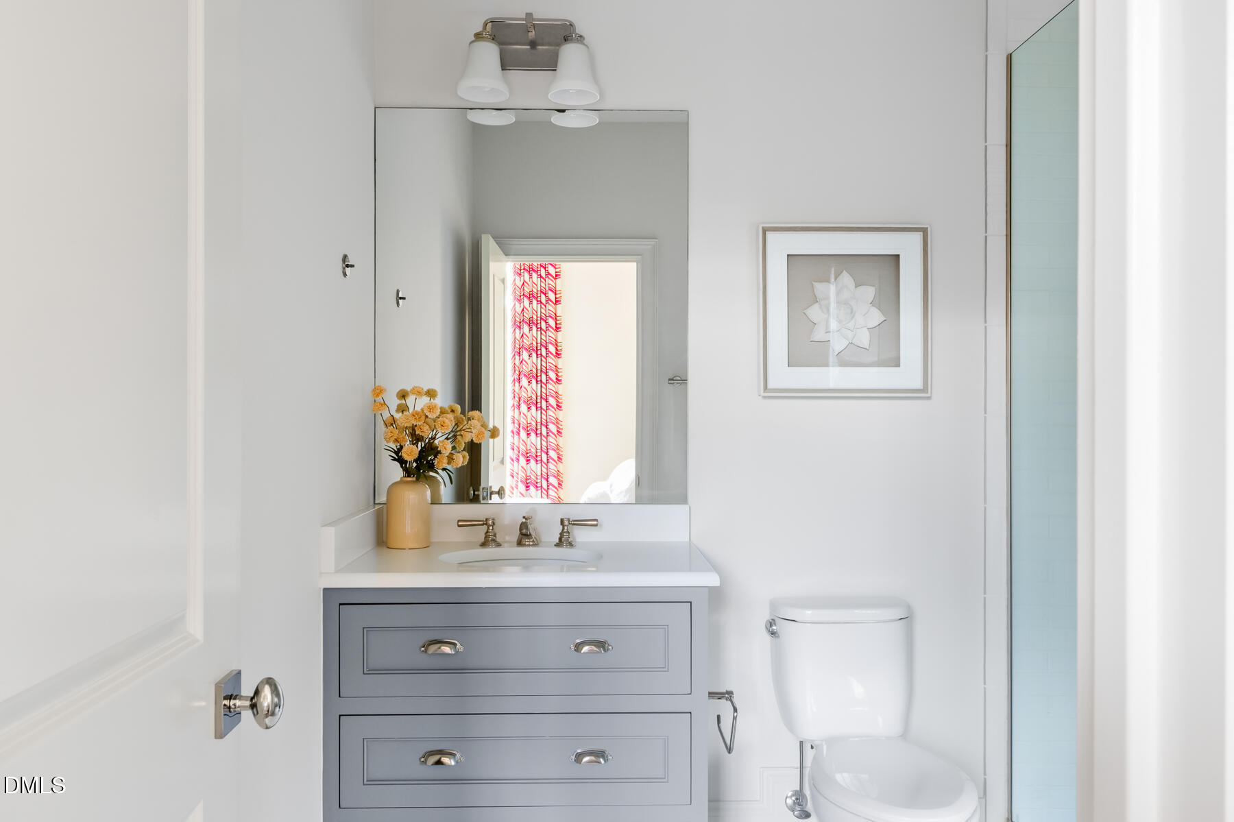 3100 Georgian Terrace Raleigh, NC 27607 - Photo 45 of 74 a bathroom with a sink vanity and a mirror