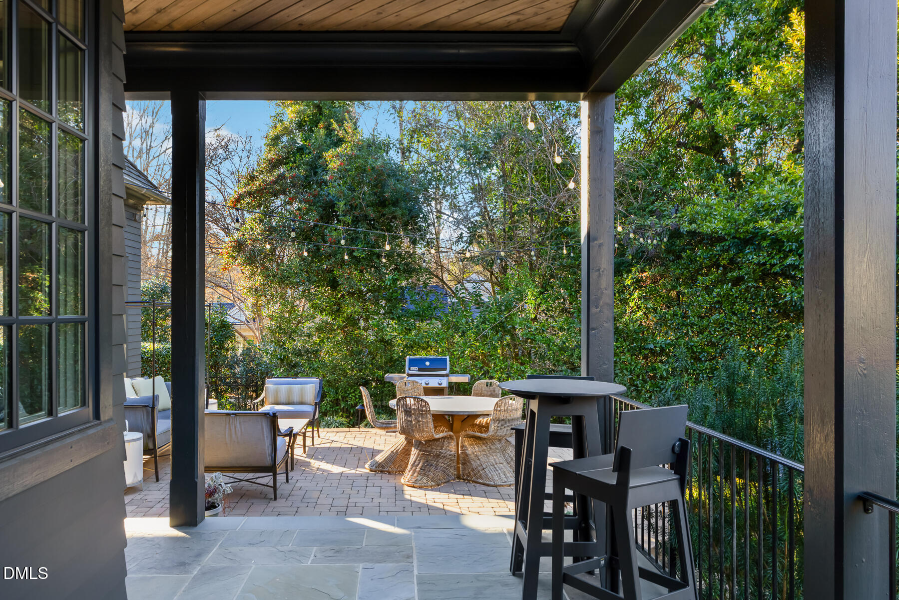 3100 Georgian Terrace Raleigh, NC 27607 - Photo 58 of 74 a view of a patio with a table chairs and a floor to ceiling window