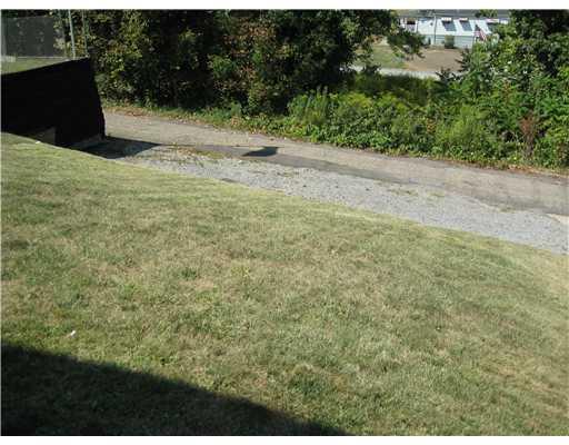 229 Hester Avenue McKees Rocks, PA 15136 - Photo 15 of 18 Land. Extra parking in back of the house. Yard is not too large - just right for a quick cut and trim on Saturday. The garage has a high ceiling