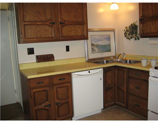 229 Hester Avenue McKees Rocks, PA 15136 - Photo 5 of 18 Kitchen. Stainless steel sink and oak look cabinets are ready for you to use.