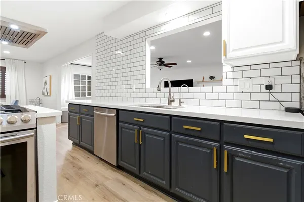 a kitchen with a sink and cabinets