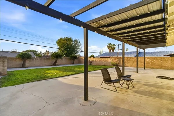 a view of a swimming pool with a patio