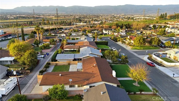 an aerial view of residential houses with outdoor space