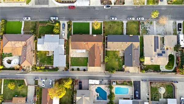 a view of building with yard and outdoor seating
