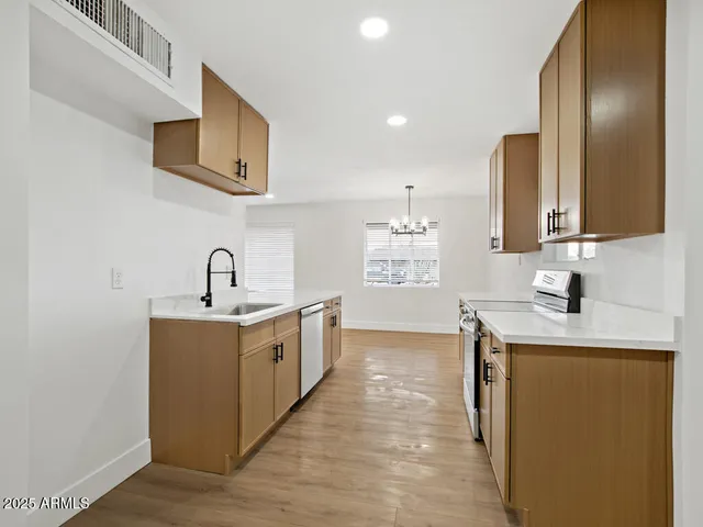 a view with a sink and a window