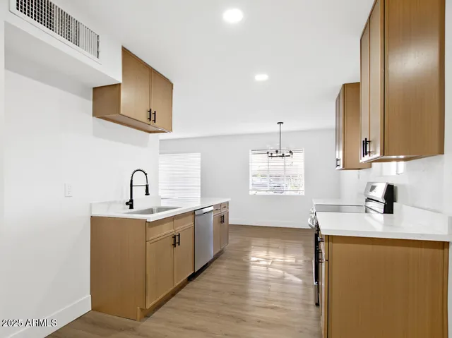 a kitchen with a stove and a microwave
