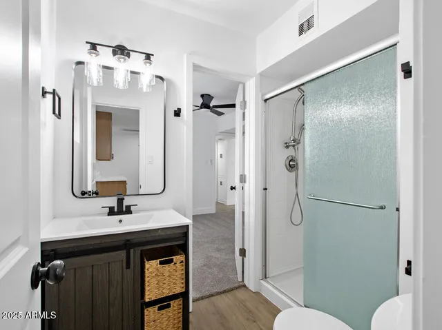 a white toilet sitting next to a bathroom sink