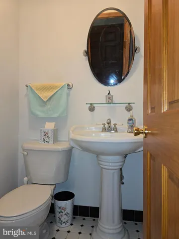 a bathroom with a toilet and a sink